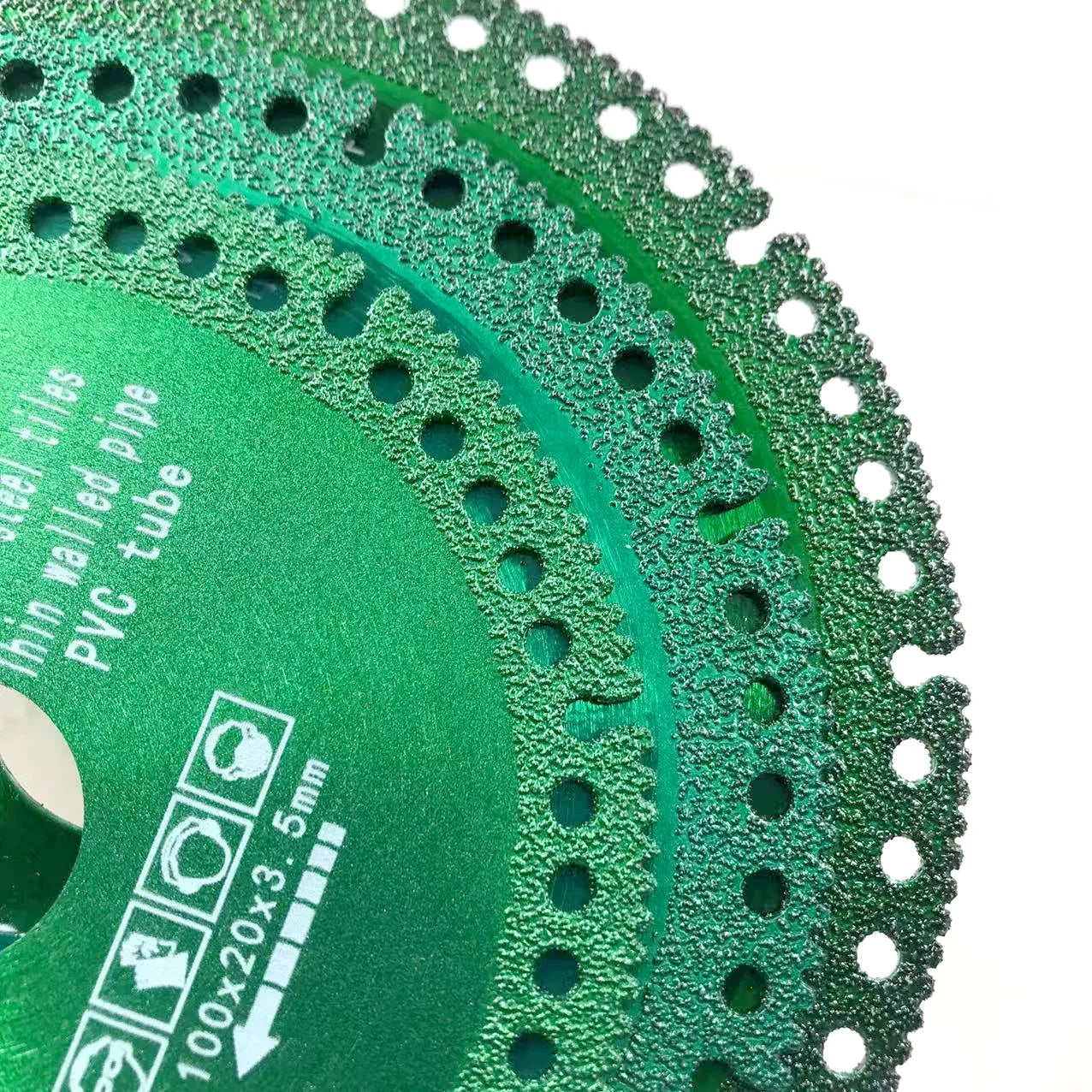 Diamond saw blade in use on angle grinder cutting tile