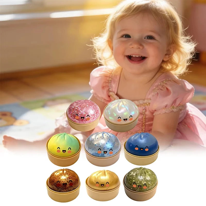 Baby playing with glitter dumpling squishy stress ball — soft safe sensory toy