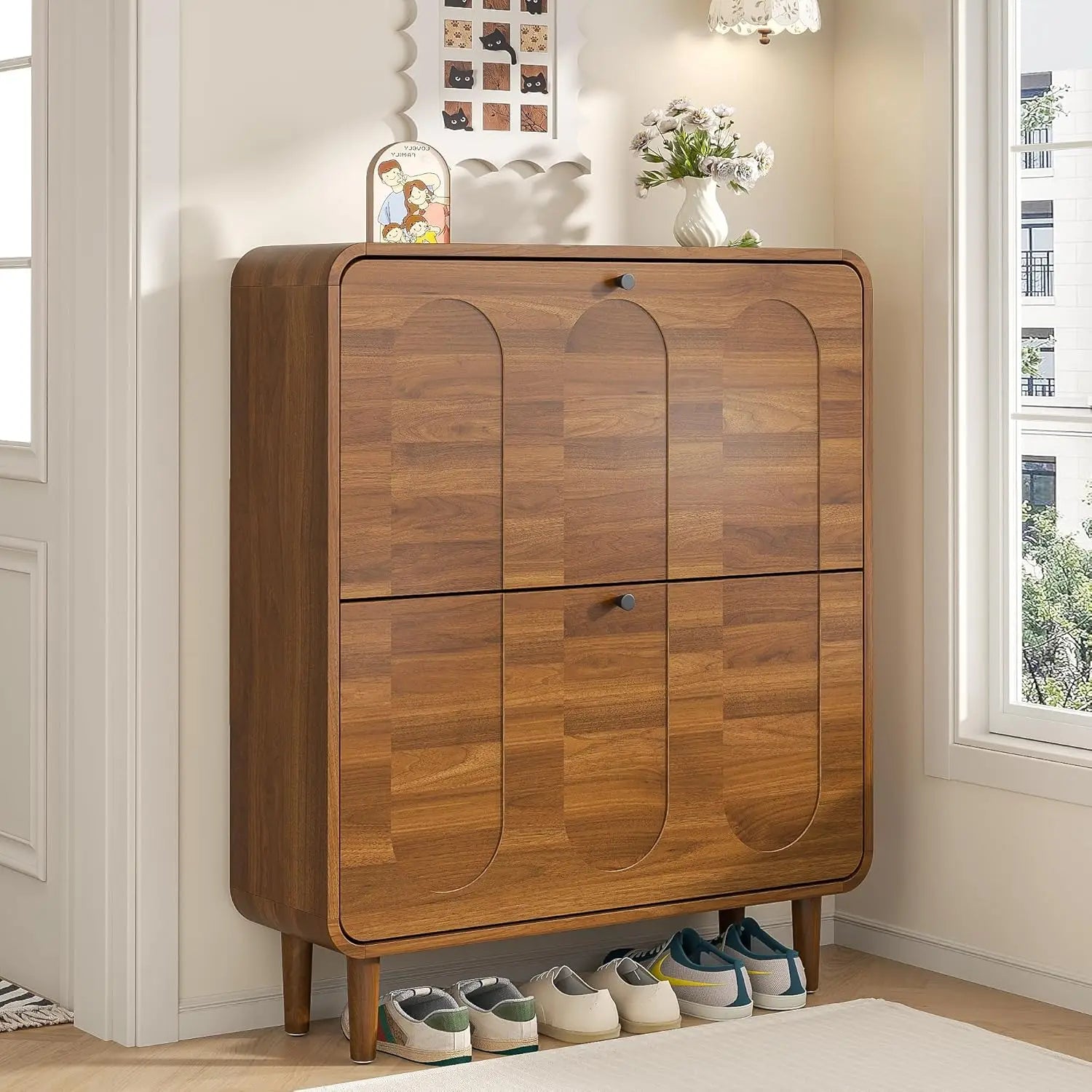 Narrow shoe cabinet closed in entryway — slim profile with tapered legs