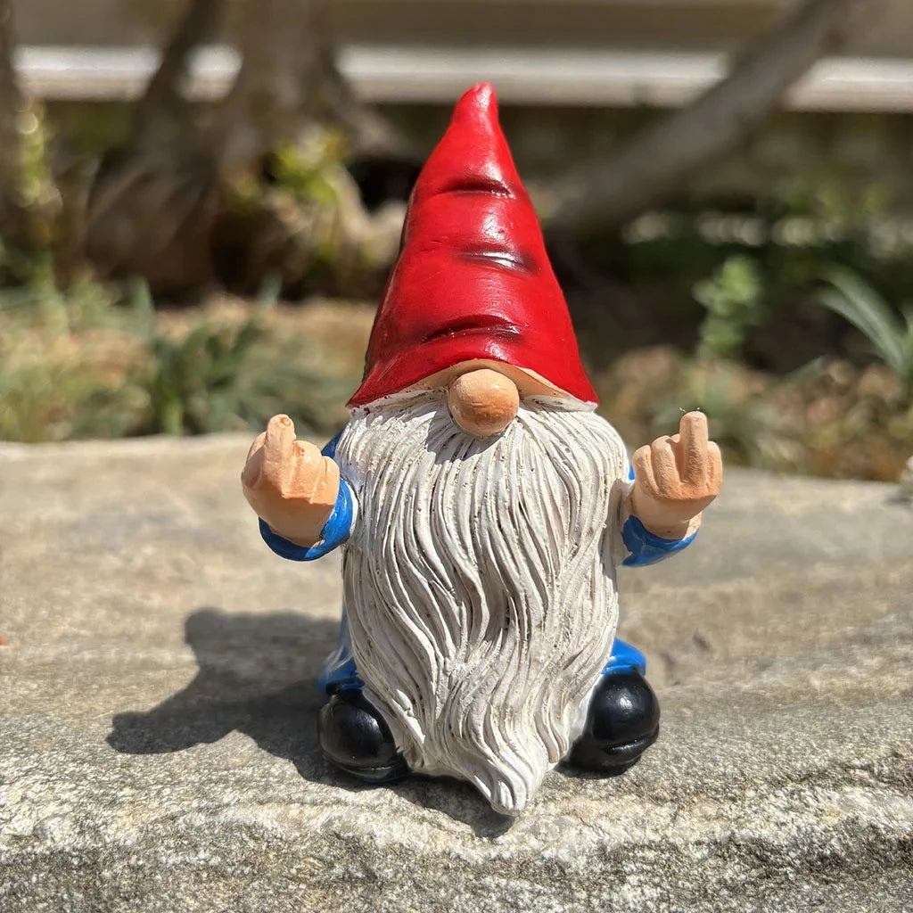 Funny garden gnome decoration placed in outdoor garden setting
