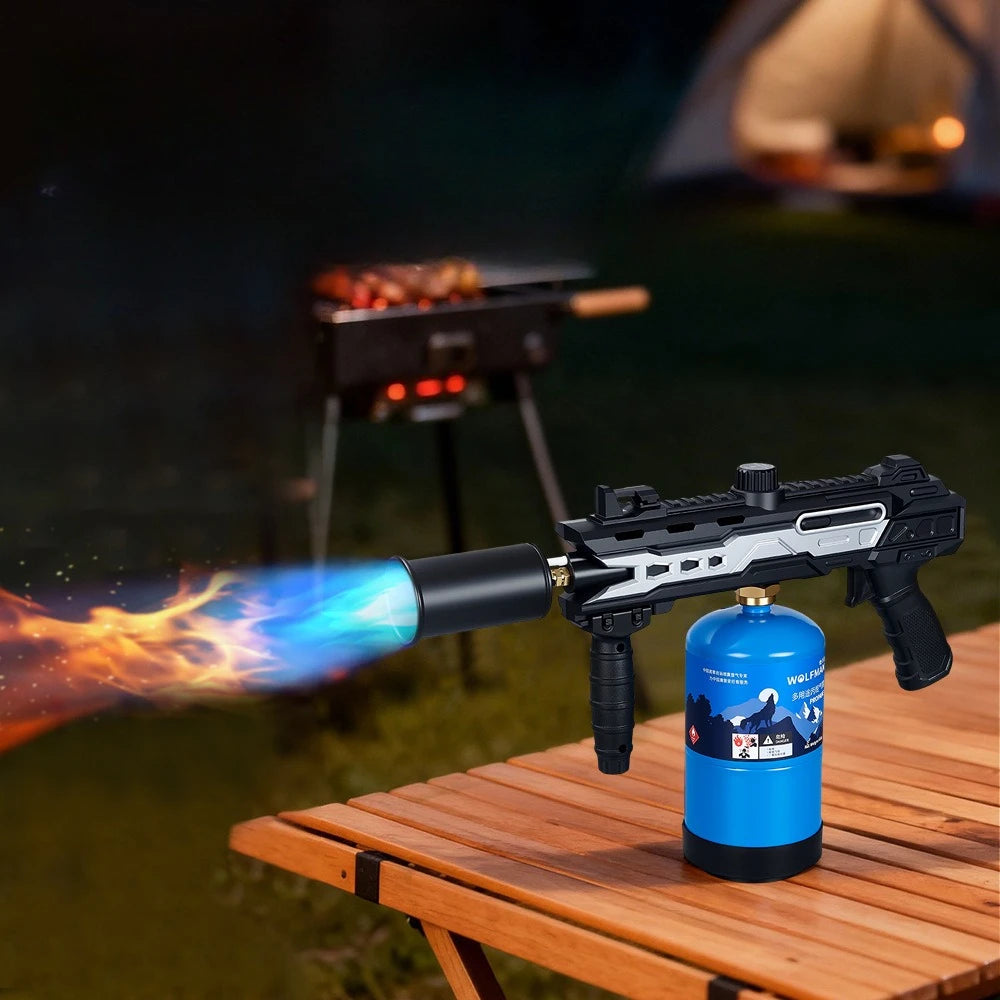 High power propane torch firing blue flame at BBQ camping outdoor night