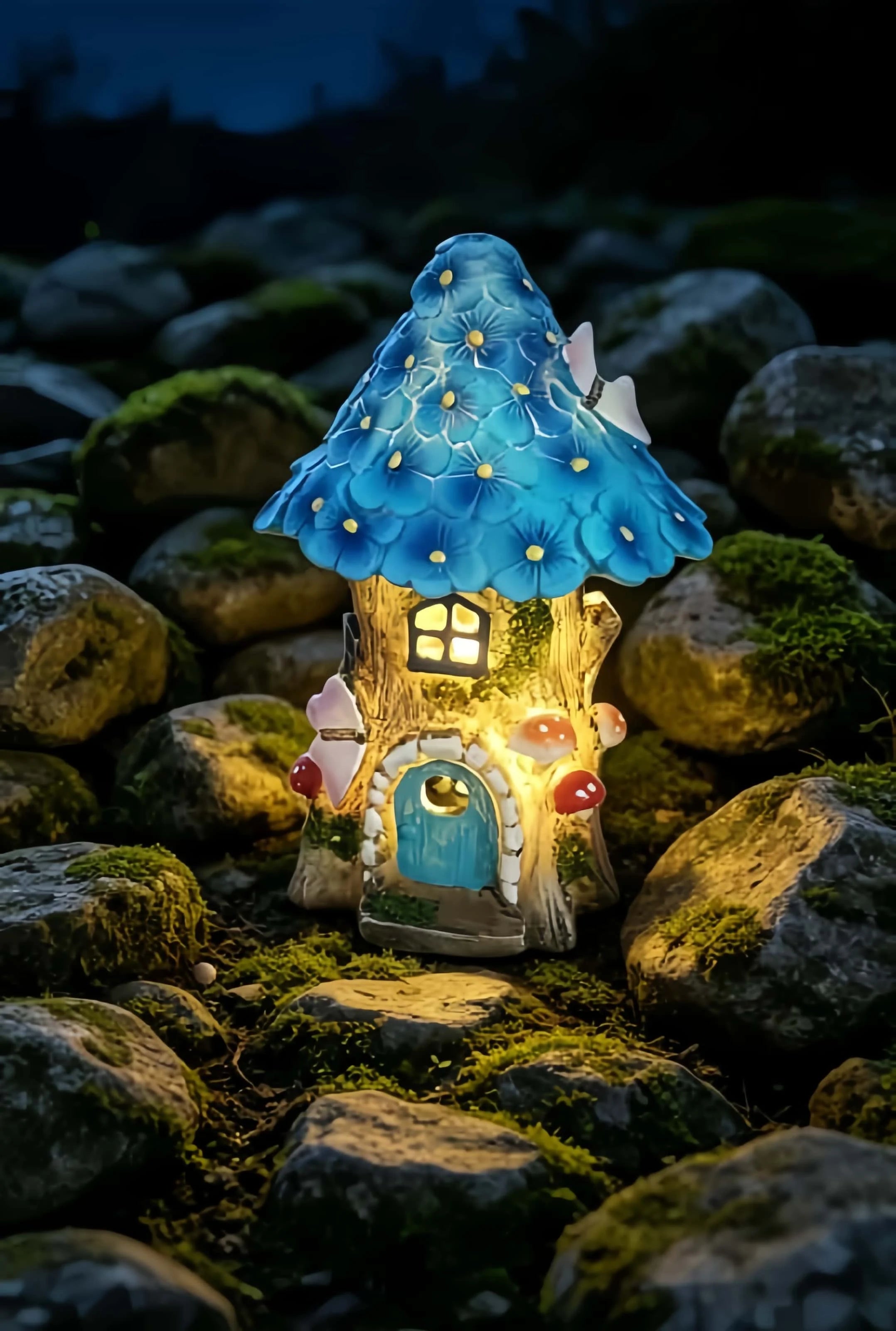 Solar fairy house detail — mushrooms butterfly glowing windows resin sculpture