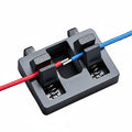 Close-up of spring mechanism inside soldering wire fixture clamp