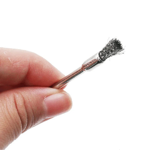 Hand holding steel wire wheel brush 25mm rotary tool