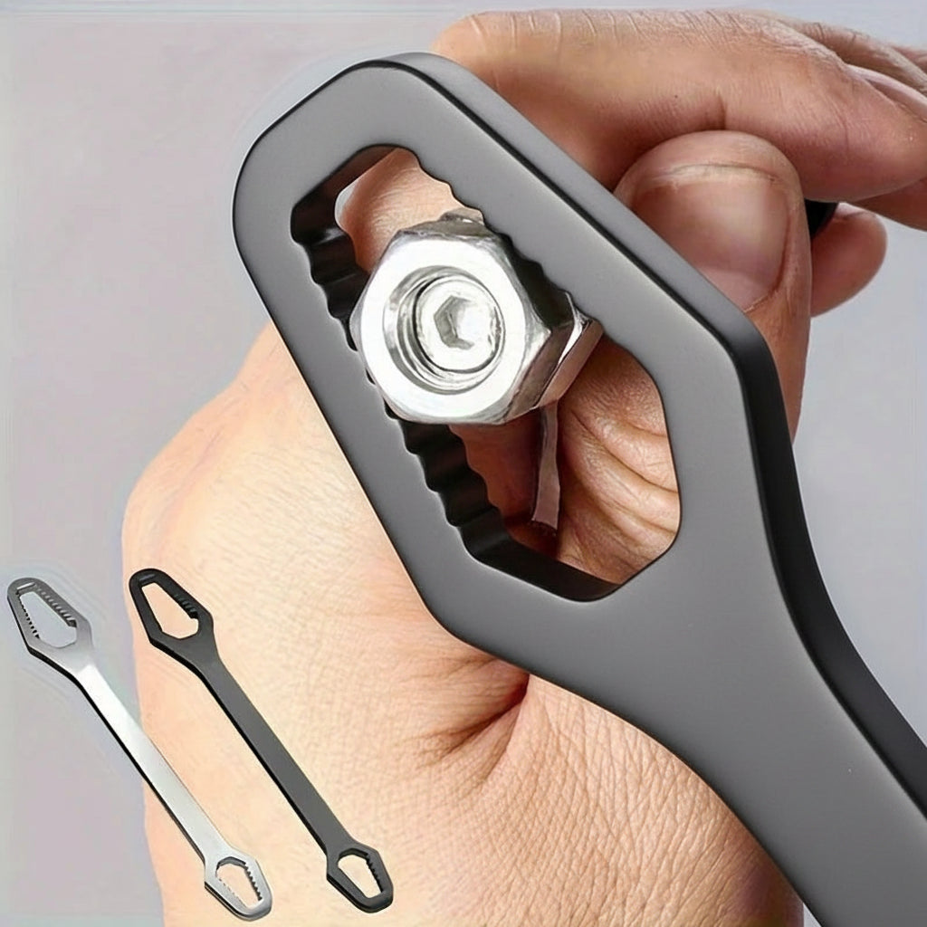 Universal wrench gripping nut in hand — self-tightening serrated jaw design